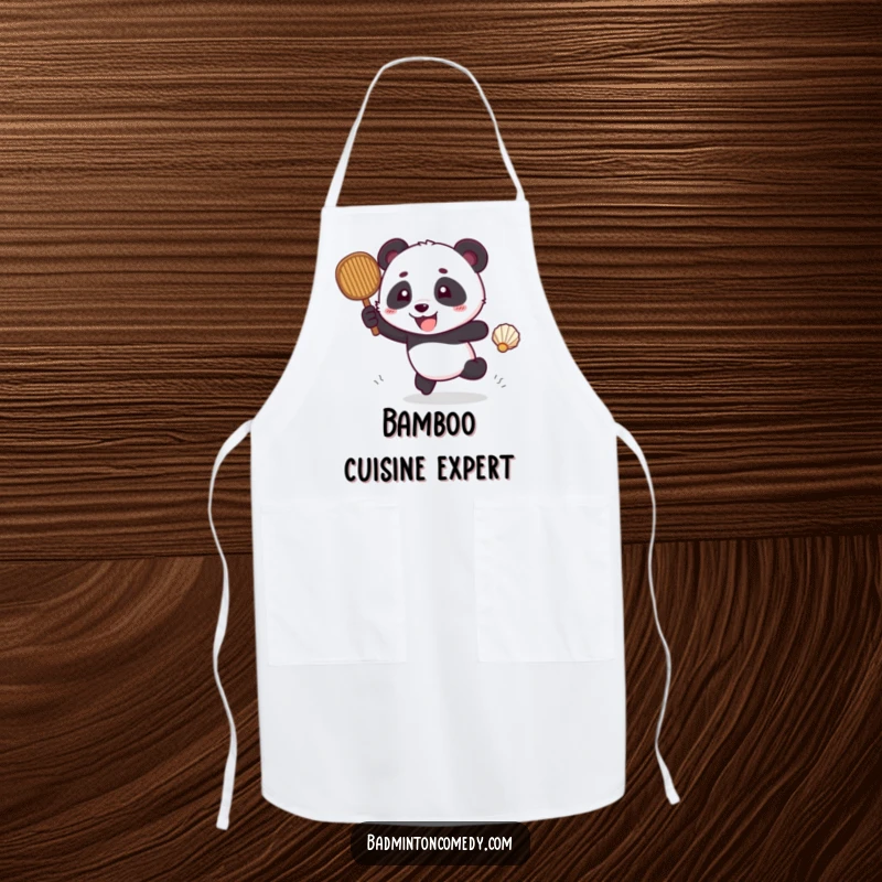 Funny panda humorously chasing a shuttlecock with a racket, while wearing a kitchen apron.