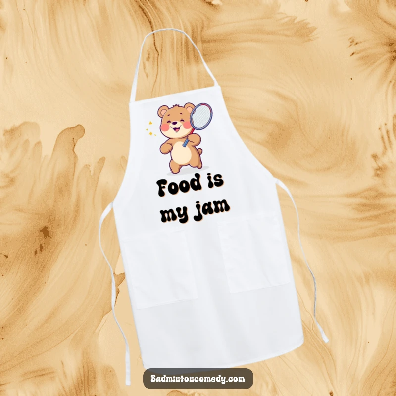 Funny Bear Badminton Apron showing a happy bear character ready to serve up a meal with a badminton racket, adding kitchen humor.