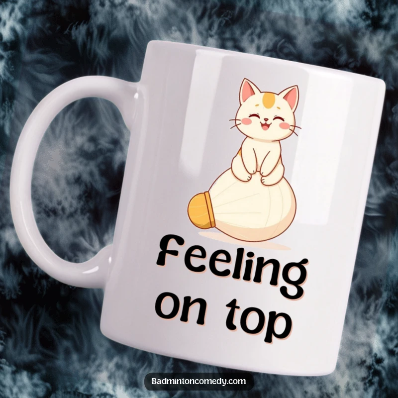 Funny mug featuring a happy cat sitting proudly atop a giant shuttlecock, looking supremely pleased with its perch.