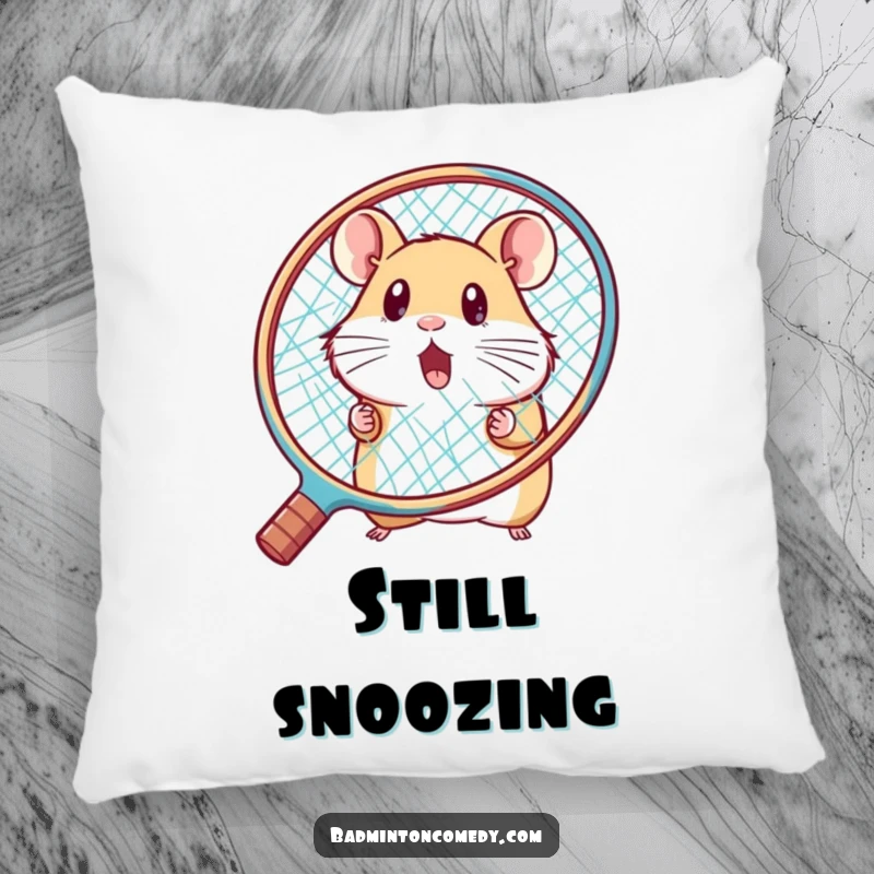 Funny hamster peeking behind a big racket, surprised, on a soft badminton pillow, an amusing gift.