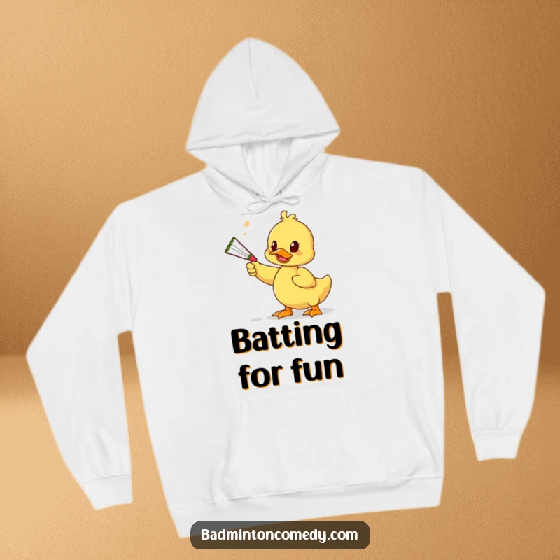 Funny Duck Play Hoodie: A duck character playfully bats a shuttlecock using a squeaky toy, embodying a humorous and lighthearted approach.