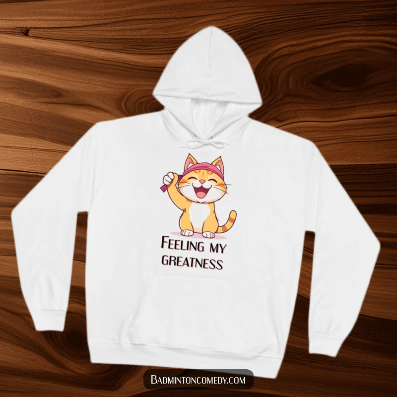 Funny Cat Badminton Hoodie: A joyful cat wearing a sweatband, celebrating a successful badminton shot, perfect for cozy victory.