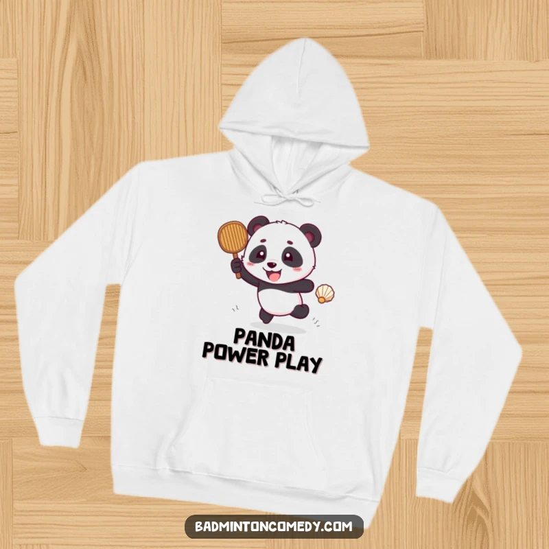 Funny panda wearing athletic gear, excitedly chasing a shuttlecock across a court, on a cozy hoodie.