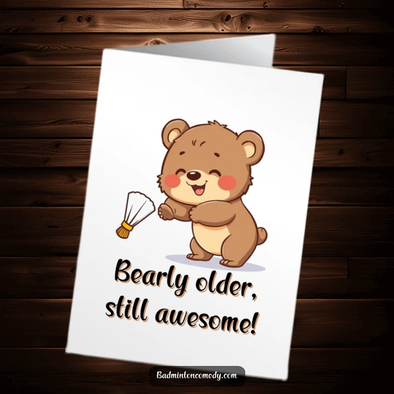 Funny Free Printable Birthday Card: A smiling bear cub playfully swings at a wayward shuttlecock, showing birthday spirit.