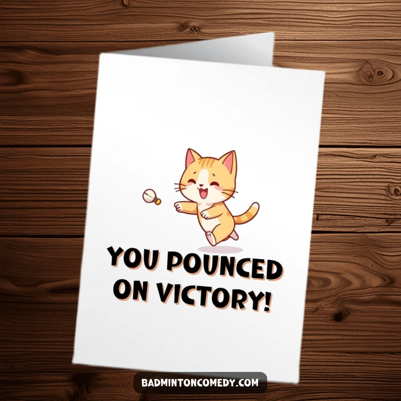 Funny Free Printable Congratulations Card: A cat joyfully chasing a shuttlecock, celebrating a win.