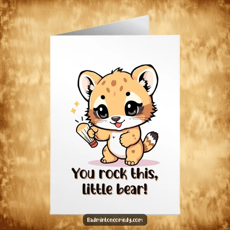 Funny Free Printable Congratulations Card: A cub joyfully bats a shuttlecock with its paw, eyes full of excitement.