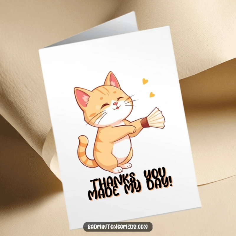 Funny Free Printable Thank You Card: A cat winks as it gracefully strikes a shuttlecock during a badminton game.