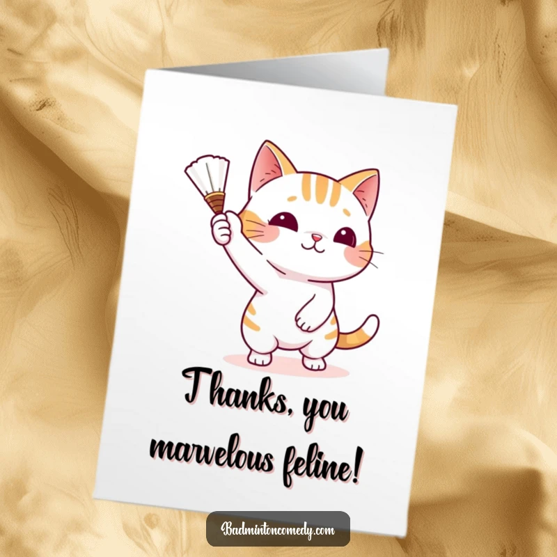 Funny free printable thank you card with a playful cat batting a shuttlecock with its paw, a cute and grateful expression.