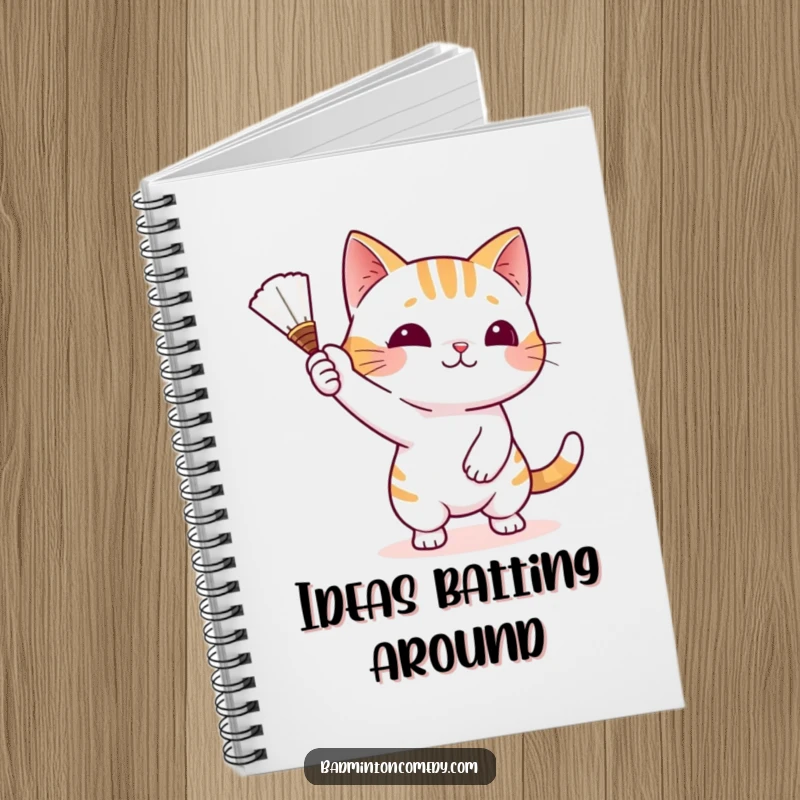 Funny Cat Game Plan Notebook featuring a playful cat character batting a shuttlecock with its paw, ready for strategic ideas.