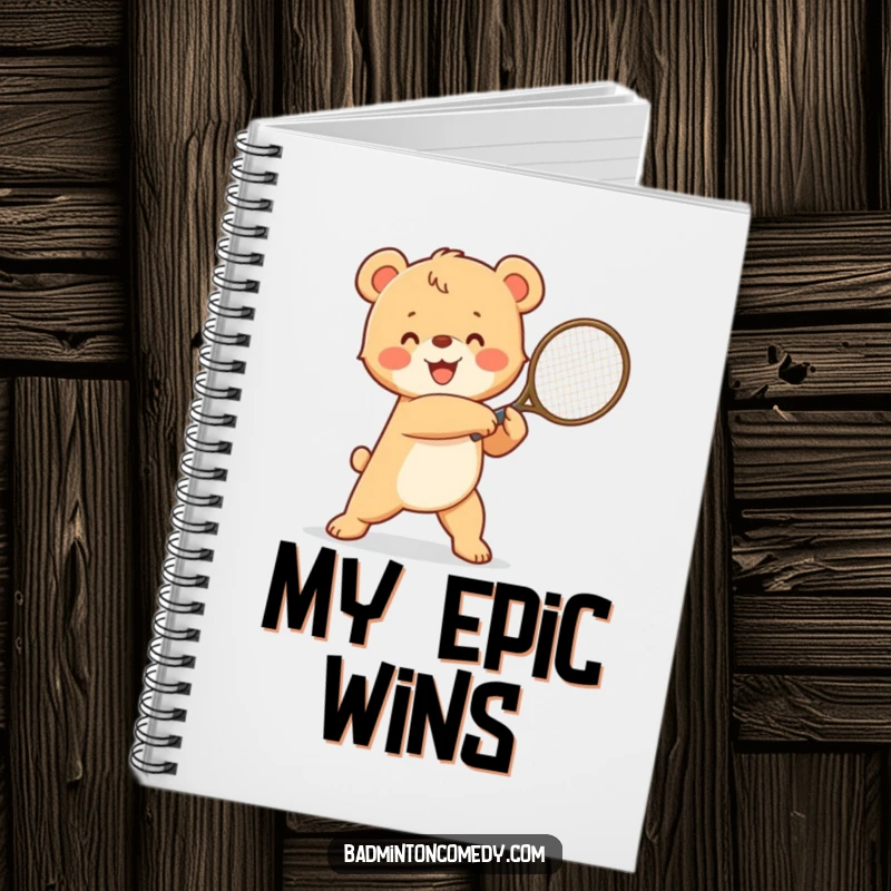Funny happy bear cub in a winning pose, swinging a tennis racket, perfect for a humorous notebook for strategy.