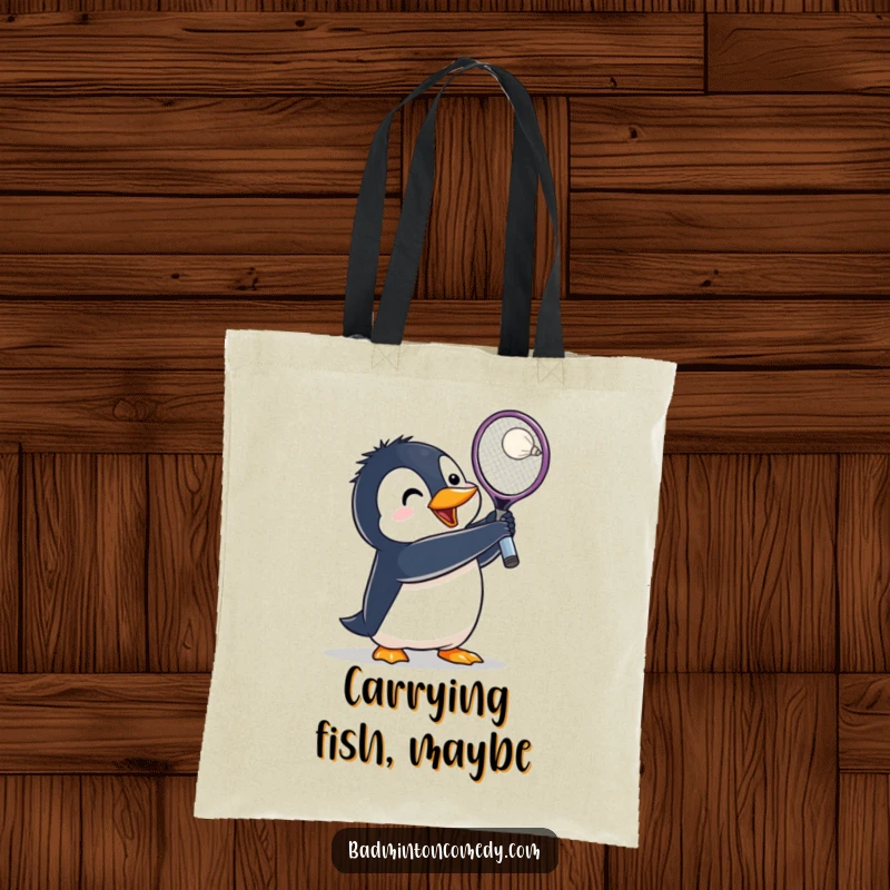 Funny Penguin Badminton Tote Bag: A penguin lunges with its racket raised high, ready to smash a shuttlecock with agility.