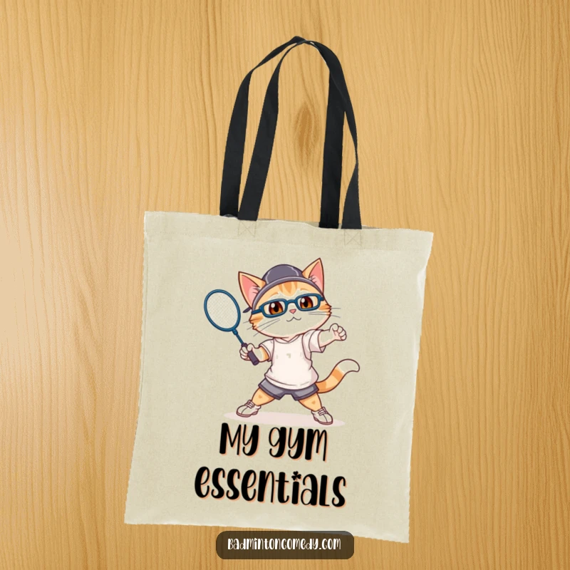 Funny cat in athletic attire, swinging a badminton racket with gusto, printed on a durable tote bag.
